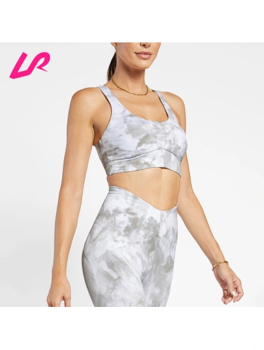 Cover up in style with our tie dye sports bra. Designed for comfort and support, it's a must-have for any workout wardrobe. Shop now and stay ahead of the trend.